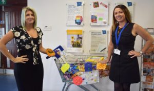 Staff bring in items for our food bank every week