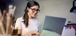 Female using her laptop at home